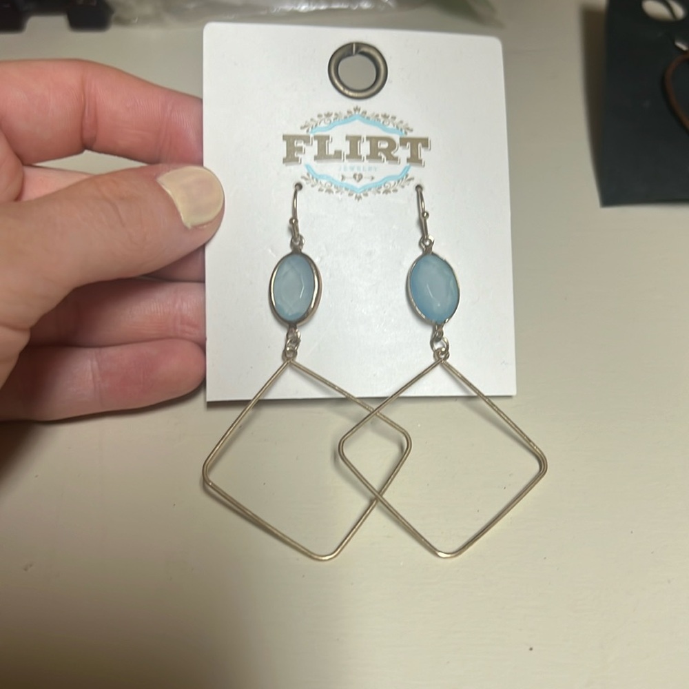 Gold earrings with blue stone